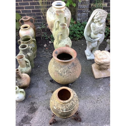 42 - Five earthenware amphora on wrought iron stands, largest height 80cm. Condition - poor to fair... 