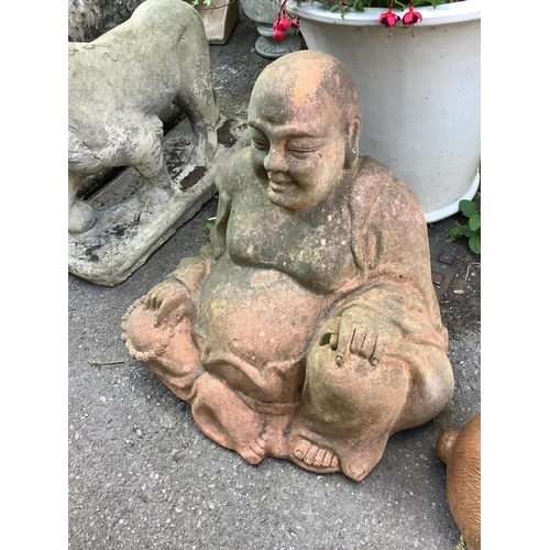 49 - A terracotta model of a seated Buddha, height 55cm, and a model of a rabbit garden ornament, length ... 