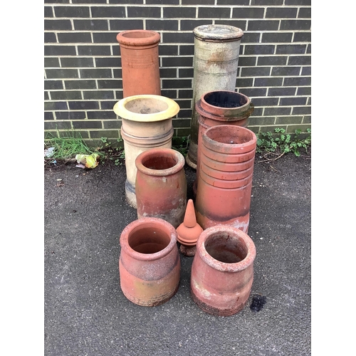 51 - Eight assorted ceramic chimney pots and a finial, largest height 93cm. Condition - weathered