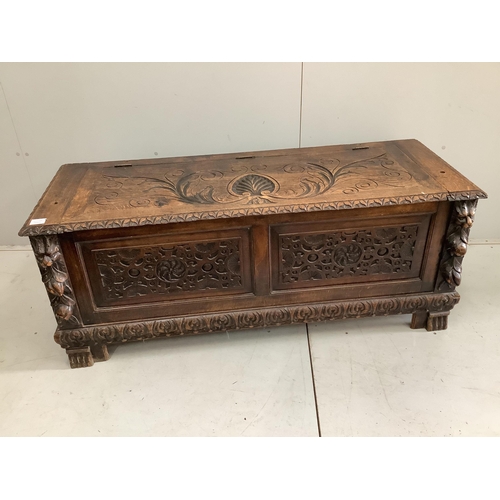 69 - An early 20th century carved oak coffer formerly a monk's bench, width 137cm. Condition - lacking or... 