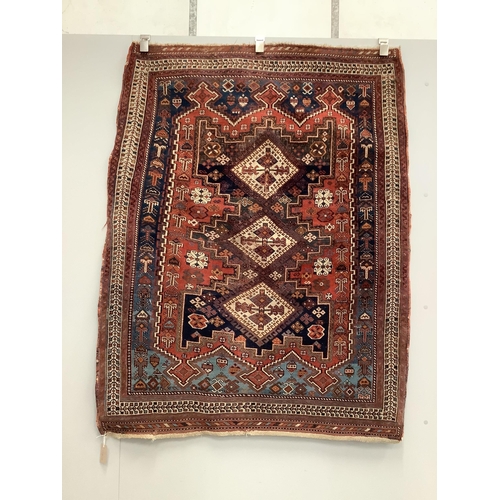 81 - A Caucasian red ground rug, 150 x 118cm. Condition - worn in centre and a little faded, further wear... 