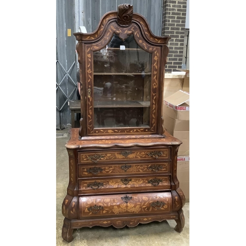 83 - An early 19th century Dutch walnut and marquetry bombe cabinet on chest, width 109cm, height 190cm. ... 