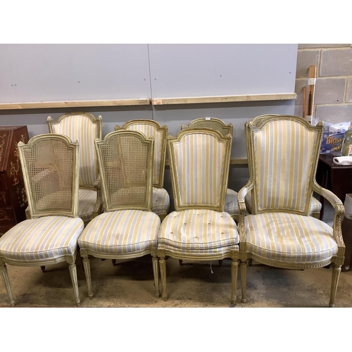 84 - A harlequin set of eight French cream painted dining chairs, comprising a pair of carvers, four cane... 