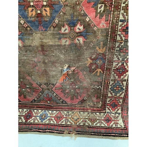 87 - An antique Caucasian geometric rug, 250 x 140cm, together with a Belouch prayer rug, 130 x 78cm. Con... 