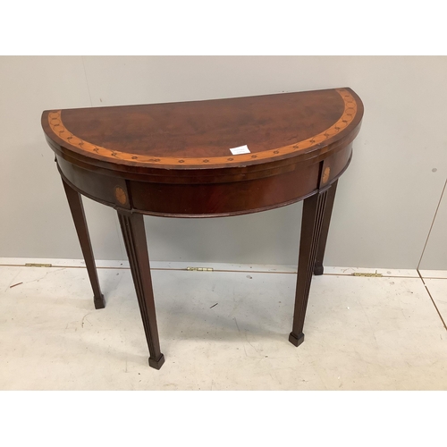 90 - An Edwardian inlaid mahogany demi lune card table, width 91cm, height 73cm. Condition - top scratche... 