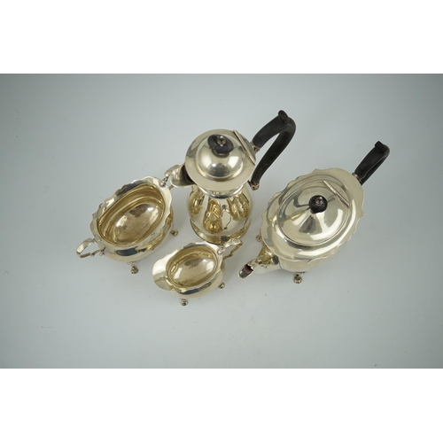 103 - A late Victorian silver four piece tea set by Walker & Hall, of oval form, comprising a teapot, hot ... 