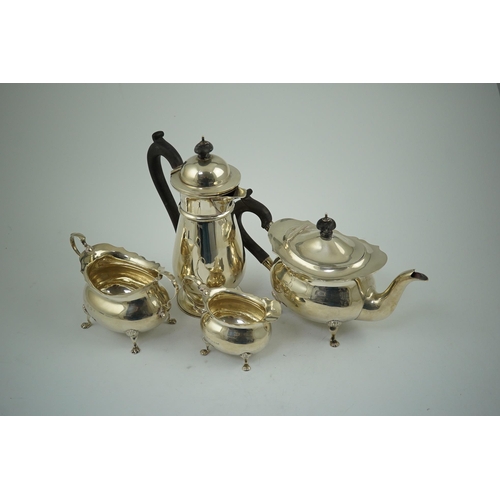 103 - A late Victorian silver four piece tea set by Walker & Hall, of oval form, comprising a teapot, hot ... 