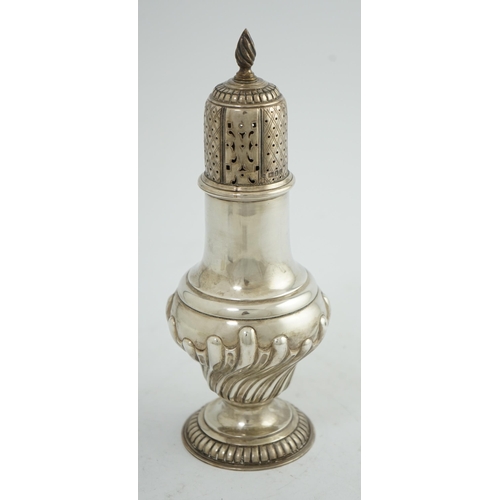 105 - An Edwardian silver baluster sugar caster, by The Barnards, on pedestal foot, with demi-fluted decor... 