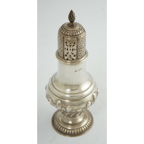 105 - An Edwardian silver baluster sugar caster, by The Barnards, on pedestal foot, with demi-fluted decor... 