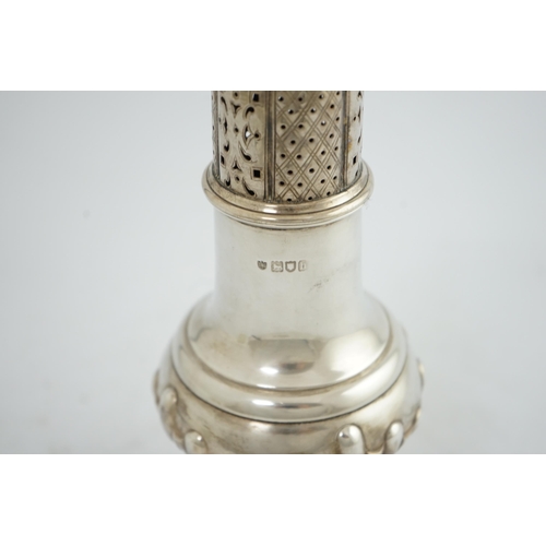 105 - An Edwardian silver baluster sugar caster, by The Barnards, on pedestal foot, with demi-fluted decor... 