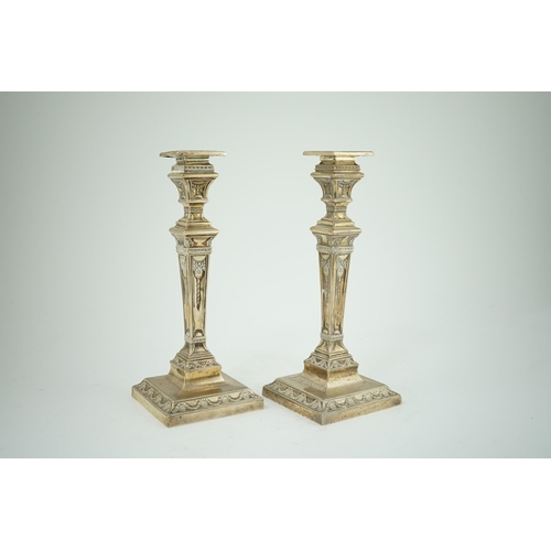 106 - A pair of Edwardian Adam revival silver candlesticks, by Walker & Hall, with beaded borders, on squa... 