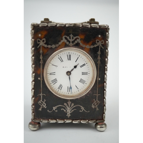 107 - An Edwardian silver mounted tortoiseshell miniature carriage timepiece, by William Comyns, with Roma... 