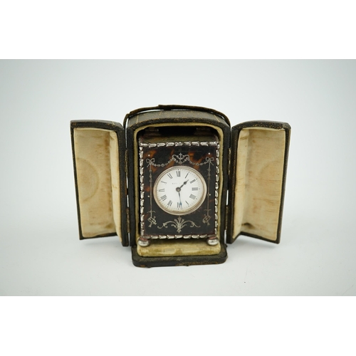 107 - An Edwardian silver mounted tortoiseshell miniature carriage timepiece, by William Comyns, with Roma... 