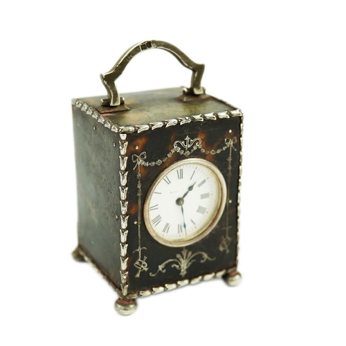 107 - An Edwardian silver mounted tortoiseshell miniature carriage timepiece, by William Comyns, with Roma... 