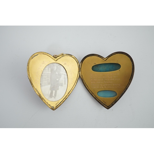 113 - An Edwardian silver gilt? and guilloche enamel large heart shaped memorial locket, the cover set wit... 