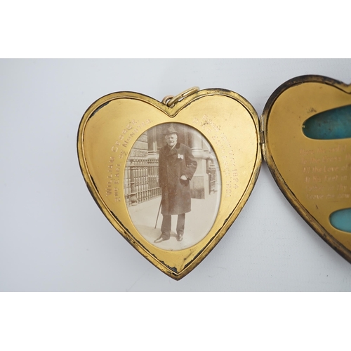 113 - An Edwardian silver gilt? and guilloche enamel large heart shaped memorial locket, the cover set wit... 