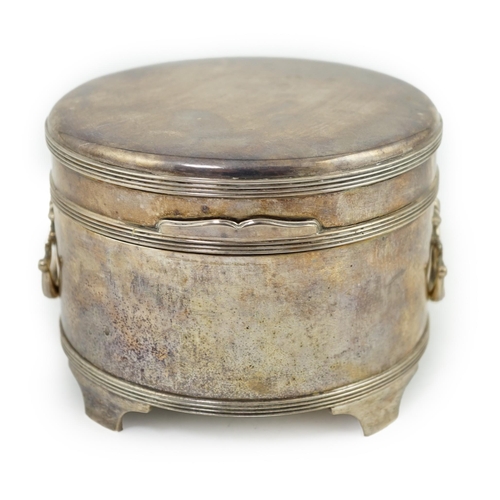 117 - A George V silver circular two handed biscuit box, with hinged cover, by Asprey & Co Ltd, on four fe... 