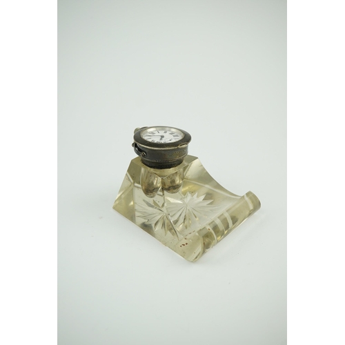 120 - An Edwardian silver watch mounted glass inkwell, maker's mark rubbed, of shaped rectangular form, wi... 