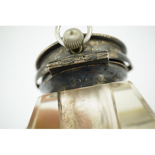 120 - An Edwardian silver watch mounted glass inkwell, maker's mark rubbed, of shaped rectangular form, wi... 