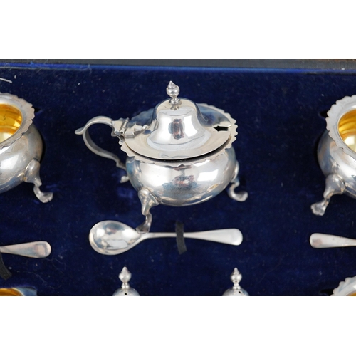 123 - A George V cased silver seven piece condiment set by Horace Woodward & Co Ltd, Birmingham, 1918, wit... 