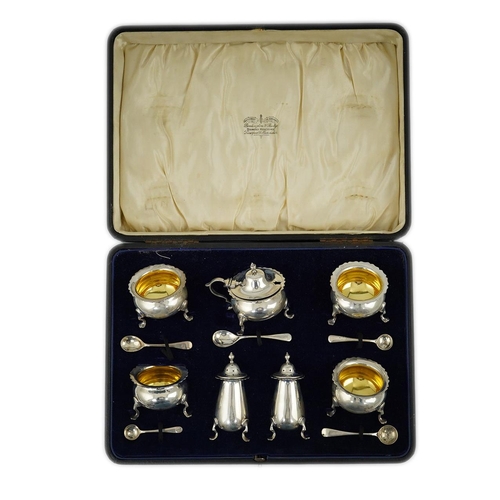 123 - A George V cased silver seven piece condiment set by Horace Woodward & Co Ltd, Birmingham, 1918, wit... 