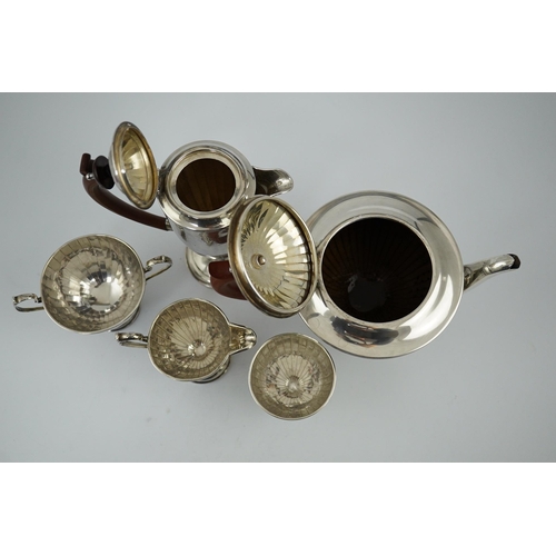 125 - A George V panelled silver five piece tea set by Adie Brothers, of circular pedestal form, Birmingha... 