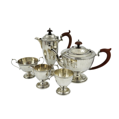 125 - A George V panelled silver five piece tea set by Adie Brothers, of circular pedestal form, Birmingha... 