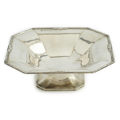 128 - A George V Art Deco silver pedestal fruit bowl, by Elkington & Co, of square form, with canted corne... 