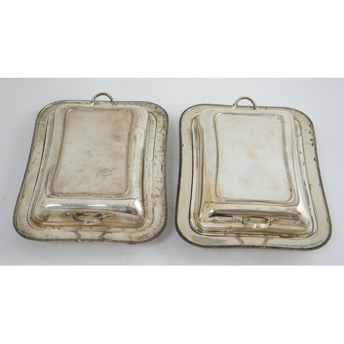 129 - A pair of 1930's silver entrée dishes and covers, by Roberts & Belk, of rectangular form, Sheffield,... 