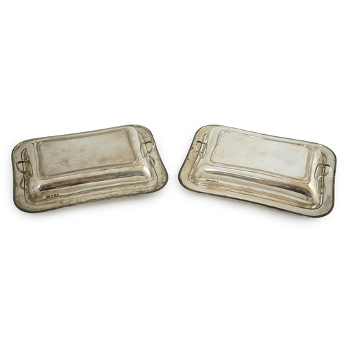 129 - A pair of 1930's silver entrée dishes and covers, by Roberts & Belk, of rectangular form, Sheffield,... 