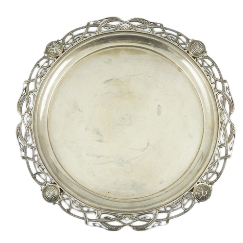 132 - A George V silver salver with pierced Celtic border, by Atkin Brothers, of circular form, with engra... 