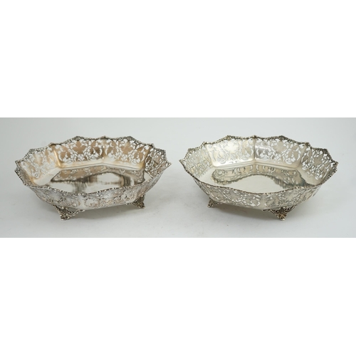 133 - A pair of George VI pierced silver shallow circular fruit bowls, by Mappin & Webb, with leaf decorat... 