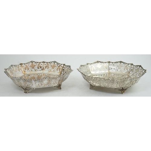 133 - A pair of George VI pierced silver shallow circular fruit bowls, by Mappin & Webb, with leaf decorat... 