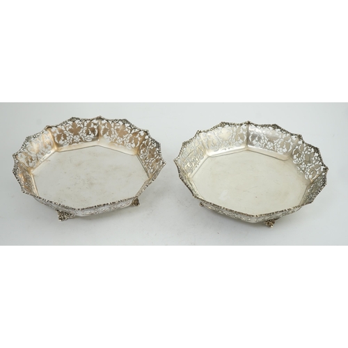 133 - A pair of George VI pierced silver shallow circular fruit bowls, by Mappin & Webb, with leaf decorat... 