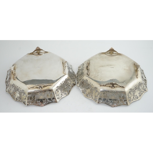 133 - A pair of George VI pierced silver shallow circular fruit bowls, by Mappin & Webb, with leaf decorat... 