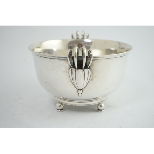 135 - A stylish 1930's Danish silver two handled fruit bowl, by Matthiasen, dated for 1930, on four ball a... 