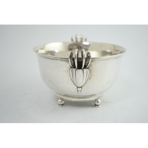 135 - A stylish 1930's Danish silver two handled fruit bowl, by Matthiasen, dated for 1930, on four ball a... 