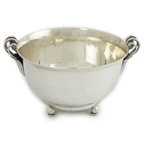 135 - A stylish 1930's Danish silver two handled fruit bowl, by Matthiasen, dated for 1930, on four ball a... 