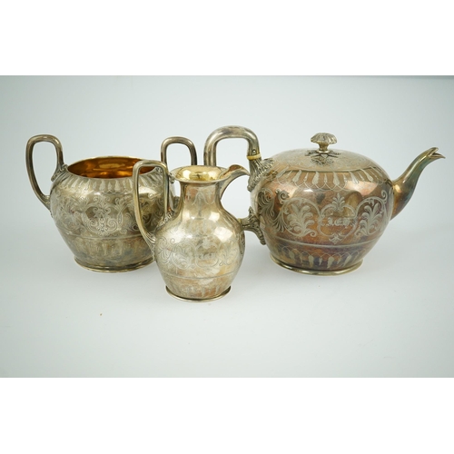 153 - A Victorian silver three piece tea set by John & Joseph Angell, of circular form with engraved decor... 