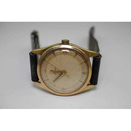 175 - A gentleman's 1950's 9ct gold Omega manual wind wrist watch, with baton and Arabic numerals, movemen... 