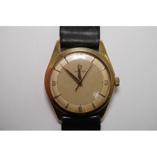 175 - A gentleman's 1950's 9ct gold Omega manual wind wrist watch, with baton and Arabic numerals, movemen... 