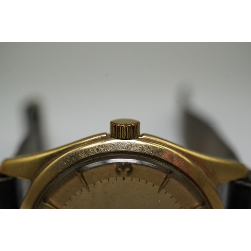 175 - A gentleman's 1950's 9ct gold Omega manual wind wrist watch, with baton and Arabic numerals, movemen... 