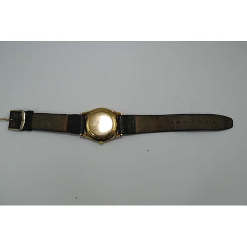 175 - A gentleman's 1950's 9ct gold Omega manual wind wrist watch, with baton and Arabic numerals, movemen... 