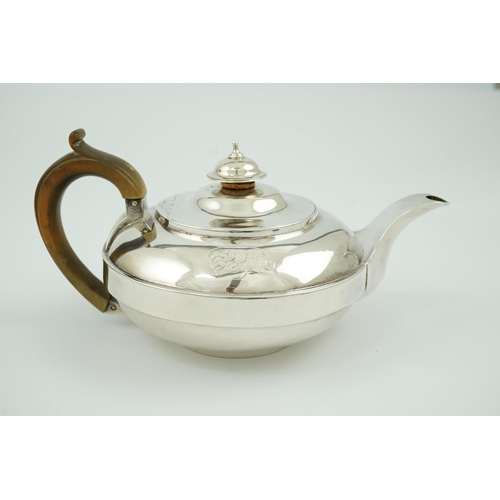 18 - A George III silver bachelor's teapot, by Eames & Barnard, of squat circular form, with engraved mon... 