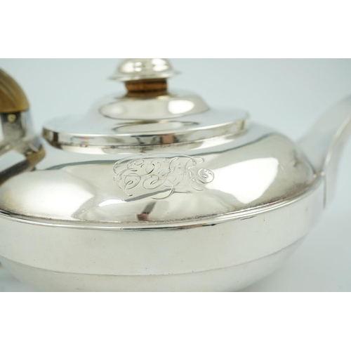 18 - A George III silver bachelor's teapot, by Eames & Barnard, of squat circular form, with engraved mon... 