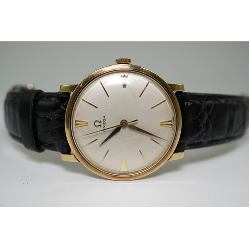 182 - A gentleman's late 1950's 9ct gold Omega manual wind wrist watch, with baton numerals, movement c.52... 