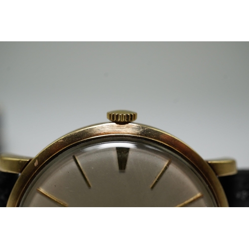 182 - A gentleman's late 1950's 9ct gold Omega manual wind wrist watch, with baton numerals, movement c.52... 