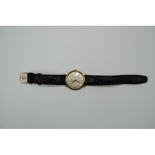 182 - A gentleman's late 1950's 9ct gold Omega manual wind wrist watch, with baton numerals, movement c.52... 