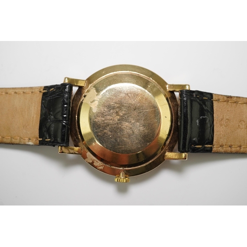 182 - A gentleman's late 1950's 9ct gold Omega manual wind wrist watch, with baton numerals, movement c.52... 