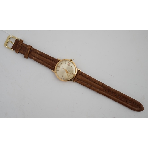 184 - A gentleman's 18k gold Valmon automatic wrist watch, with baton numerals and date aperture, case dia... 